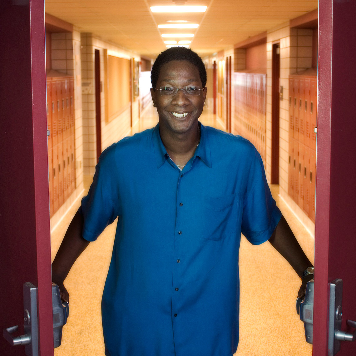 Anthony Parker, principal at Anthony Parker, the  Weston High School principal opening doors with hallway behind him