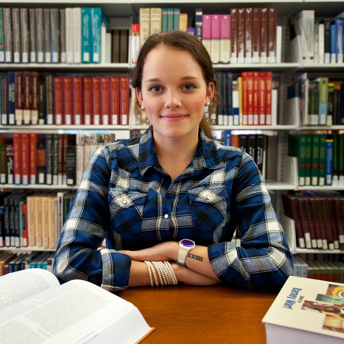 Portrait of female college student in library