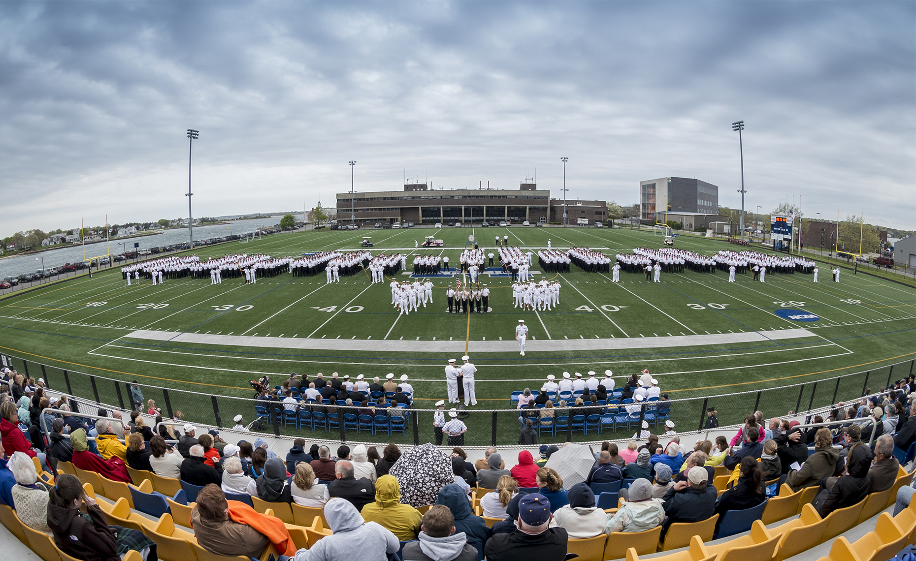 Wide angle photograph showing ceremony held at Mass Maritime Academy 